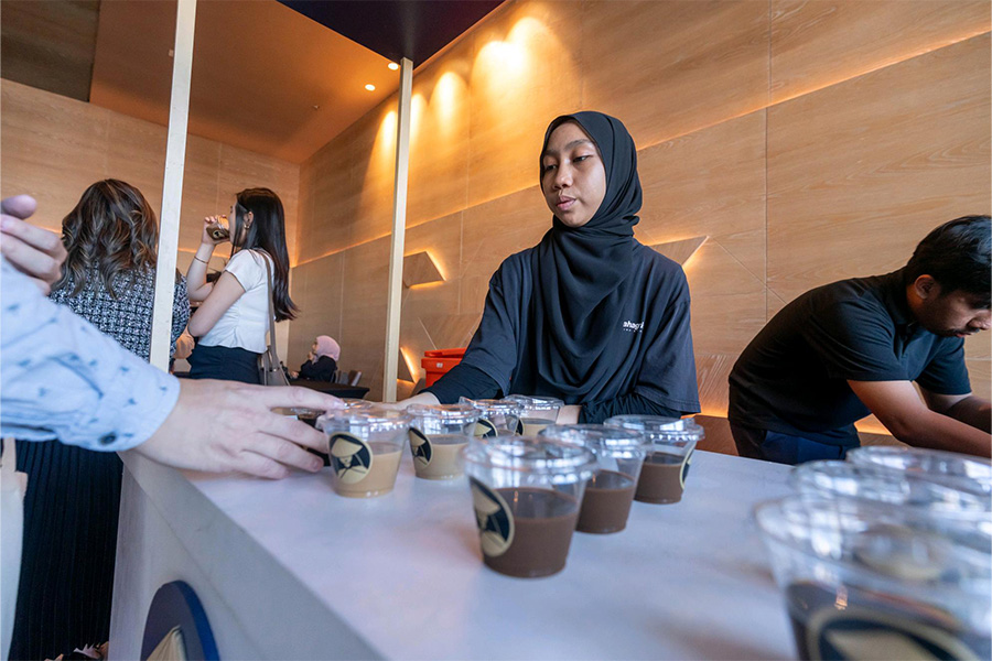 Kee Nguyen Coffee brings its signature brews to the BizSmart<sup>®</sup> Business Conference 2025, served by staff member on site.